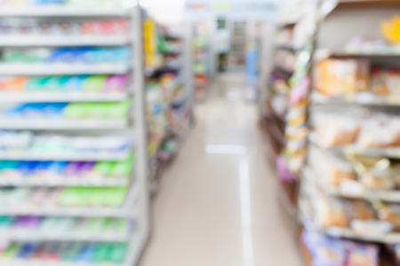 convenience store shelves blurred backgroundの写真素材