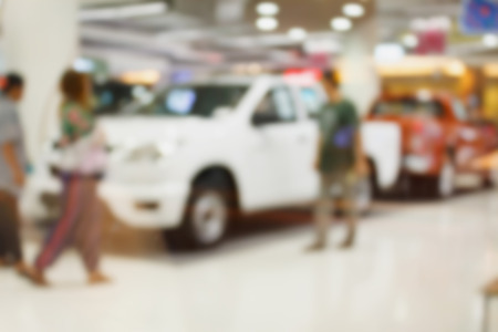 blur new car at car showroomの写真素材