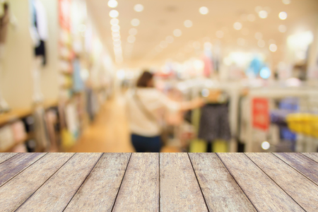 Empty table and blur clothing store with bokeh background, product displayの写真素材