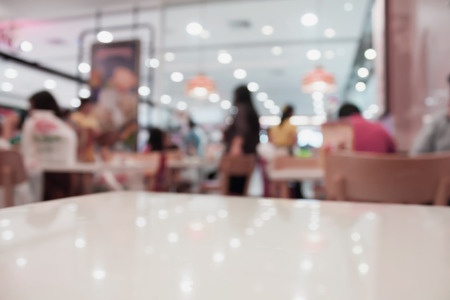 table top with blur cafe restaurant vintage toneの写真素材