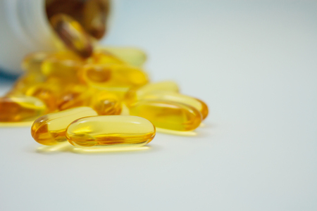Fish oil capsules and containerの写真素材