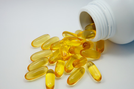 Fish oil capsules and containerの写真素材