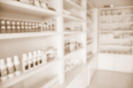 pharmacy shelves filled with medication blur backgroundの写真素材