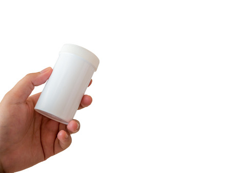 pharmacist hand holding medicine bottle isolated on white backgroundの写真素材
