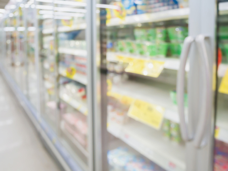 supermarket refrigerators, frozen food in supermarket freezer in large supermarket blurred backgroundの写真素材