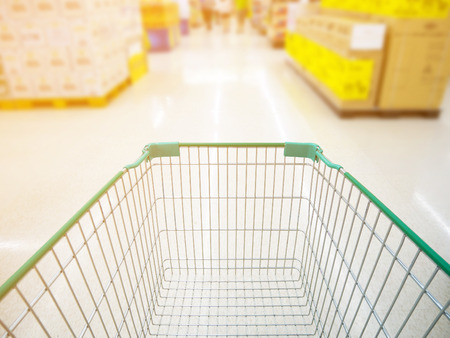 shopping cart in supermarket blur backgroundの写真素材