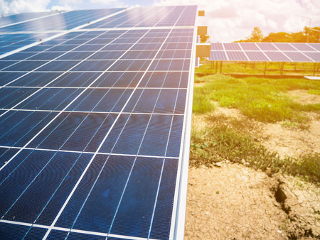 Solar panels with blue sky and clouds, solar energy environmentally friendly green energyの写真素材