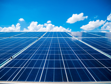 Solar panels with blue sky and clouds, solar energy environmentally friendly green energyの写真素材