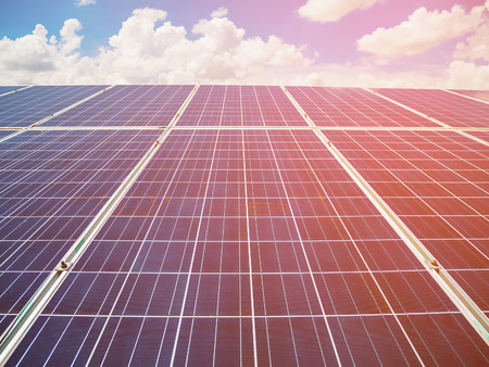 Solar panels with blue sky and clouds, solar energy environmentally friendly green energyの写真素材