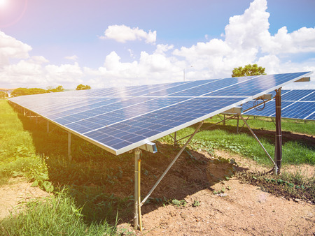 Solar panels with blue sky and clouds, solar energy environmentally friendly green energyの写真素材