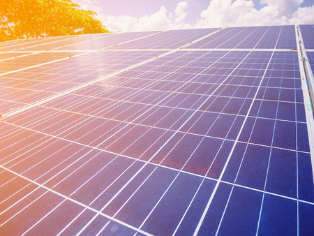 Solar panels with blue sky and clouds, solar energy environmentally friendly green energyの写真素材