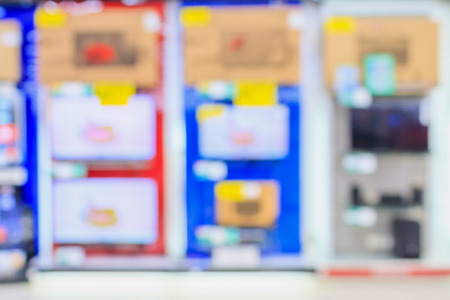 eletronic department store with Television shelves blurred backgroundの写真素材