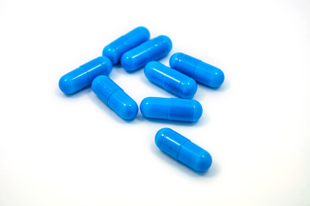 blue capsules isolated on a white background