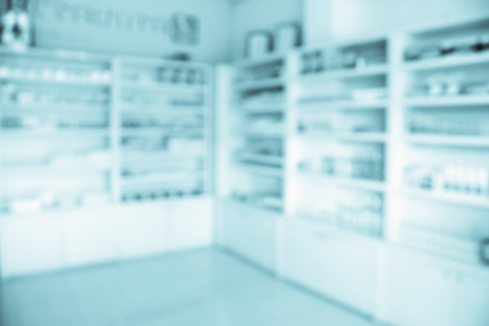 pharmacy shelves filled with medication blur backgroundの写真素材
