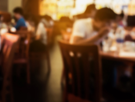 Customer in restaurant blur background, vintage toneの写真素材