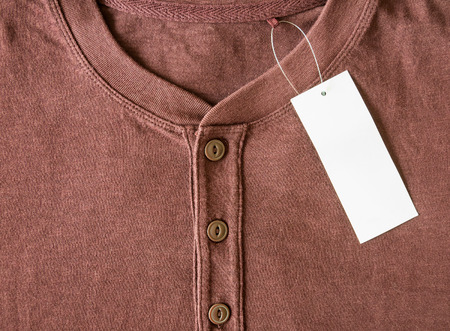 new brown shirt with blank price tagの写真素材