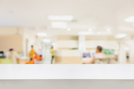 Empty white desk with blur hospital background, for product displayの写真素材