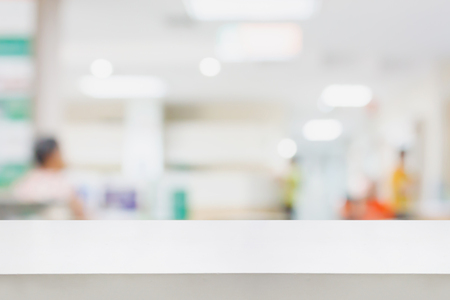 Empty white desk with blur hospital background, for product displayの写真素材