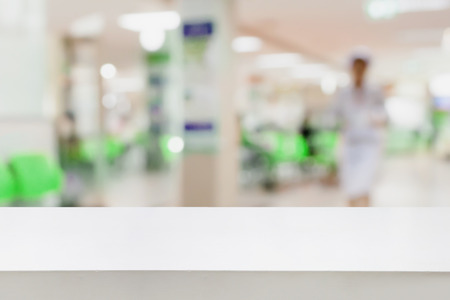 Empty white desk with blur hospital background, for product displayの写真素材