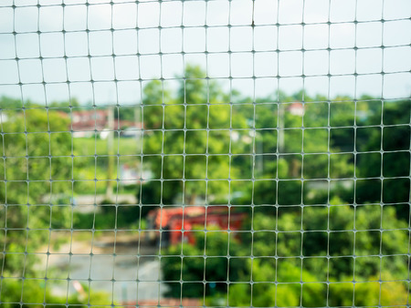 plastic net with blur garden backgroundの写真素材