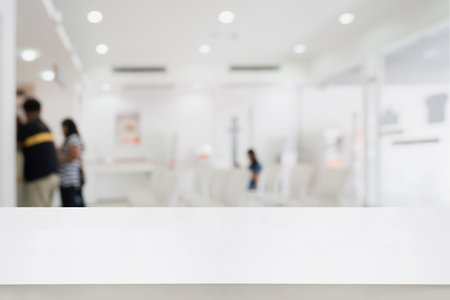 white counter with Blur abstract hospital, office, hotel or bank interior background with customer or patient at cashier counter service. For product displayの写真素材