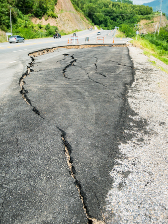 asphalt road cracked and broken textureの写真素材