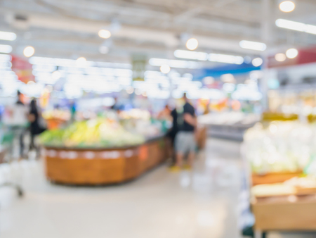 supermarket grocery store abstract blur background with customersの写真素材