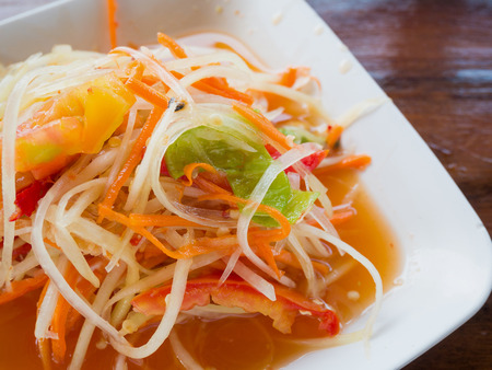 Thai papaya salad (Som tum Thai) on wood tableの写真素材