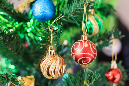 Close up colorful bauble on Christmas treeの写真素材
