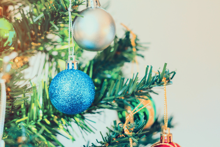 Close up colorful bauble on Christmas treeの写真素材