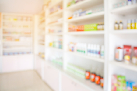 pharmacy shelves filled with medication blur backgroundの写真素材
