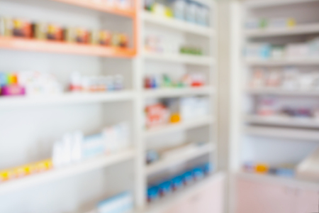 pharmacy shelves filled with medication blur backgroundの写真素材