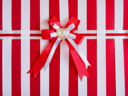 red ribbon bow with heart