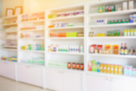 pharmacy shelves filled with medication blur backgroundの写真素材