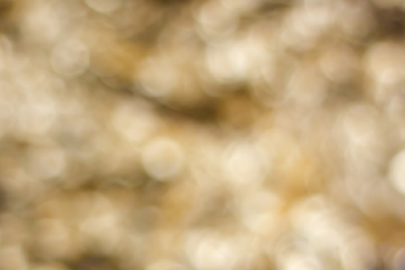 abstract golden bokeh backgroundの写真素材
