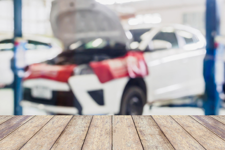 car service centre blurred background with wood tableの写真素材