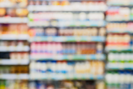 Abstract blurred supermarket with dairy product on shelvesの写真素材