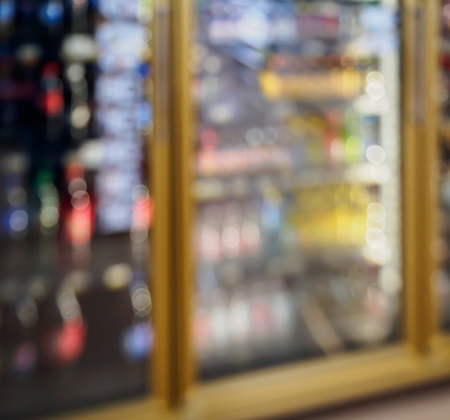 supermarket refrigerator shelves with drinks beverage productsの写真素材