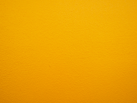 yellow paint wall backgroundの写真素材