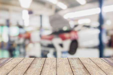 car service centre blurred background with wood tableの写真素材