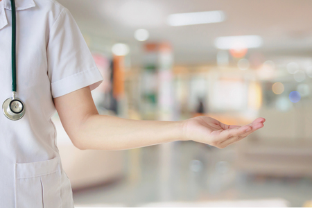 Female doctor with hospital or clinic interior blurred for backgroundの写真素材