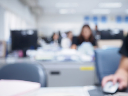 office blurred background with people working at deskの写真素材