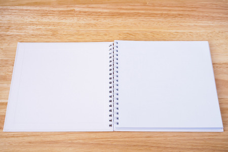 open notebook on wood table backgroundの写真素材