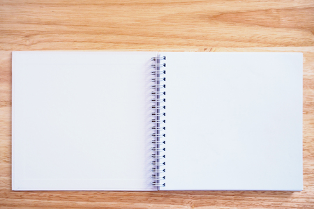 open notebook on wood table backgroundの写真素材