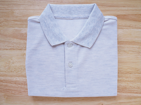 men t-shirts on wood floorの写真素材