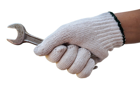 Mechanic hand hold wrench tool in hand isolated on whiteの写真素材
