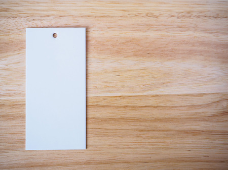 blank white price label on wood backgroundの写真素材