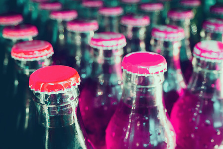 glass bottles with soft drinks backgroundの写真素材