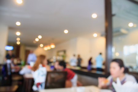 cafe restaurant blurred background with bokeh vintage color styleの写真素材