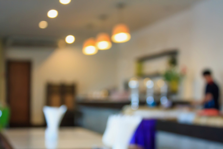 cafe restaurant blurred background with bokeh vintage color styleの写真素材